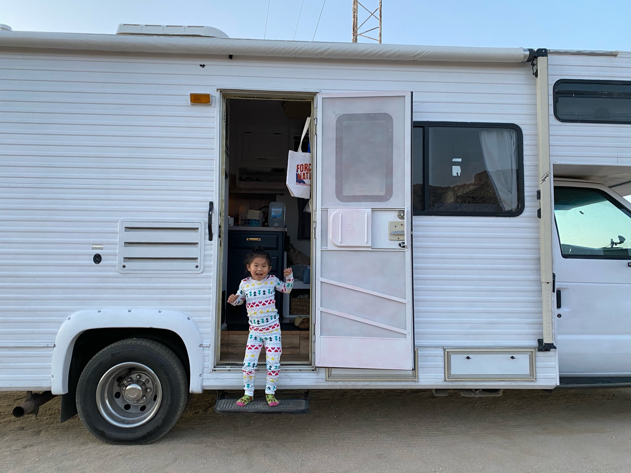 Child playing outside an RV campsite