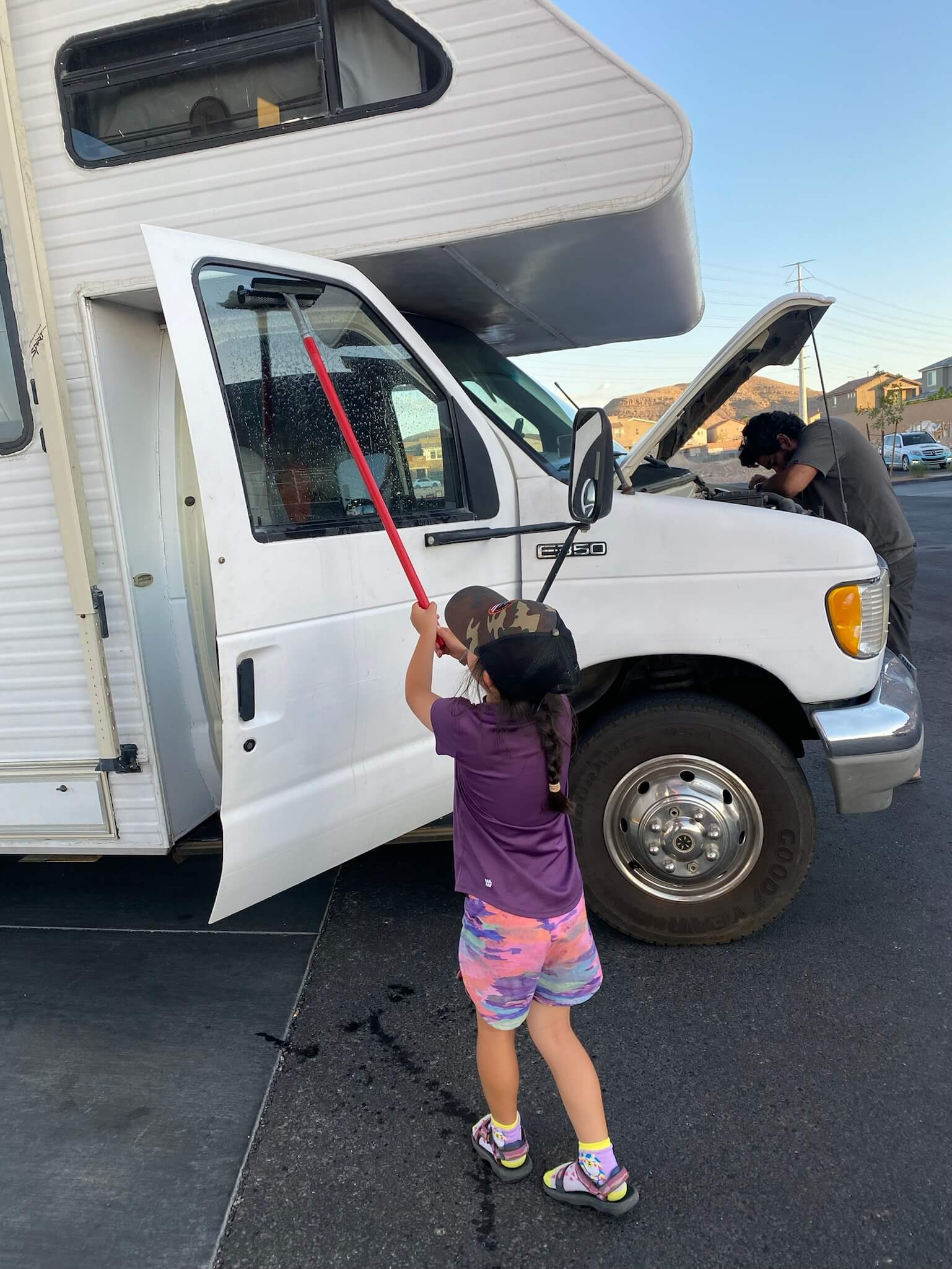 Vera helping Jesse work on Goldie — the next generation of fixers