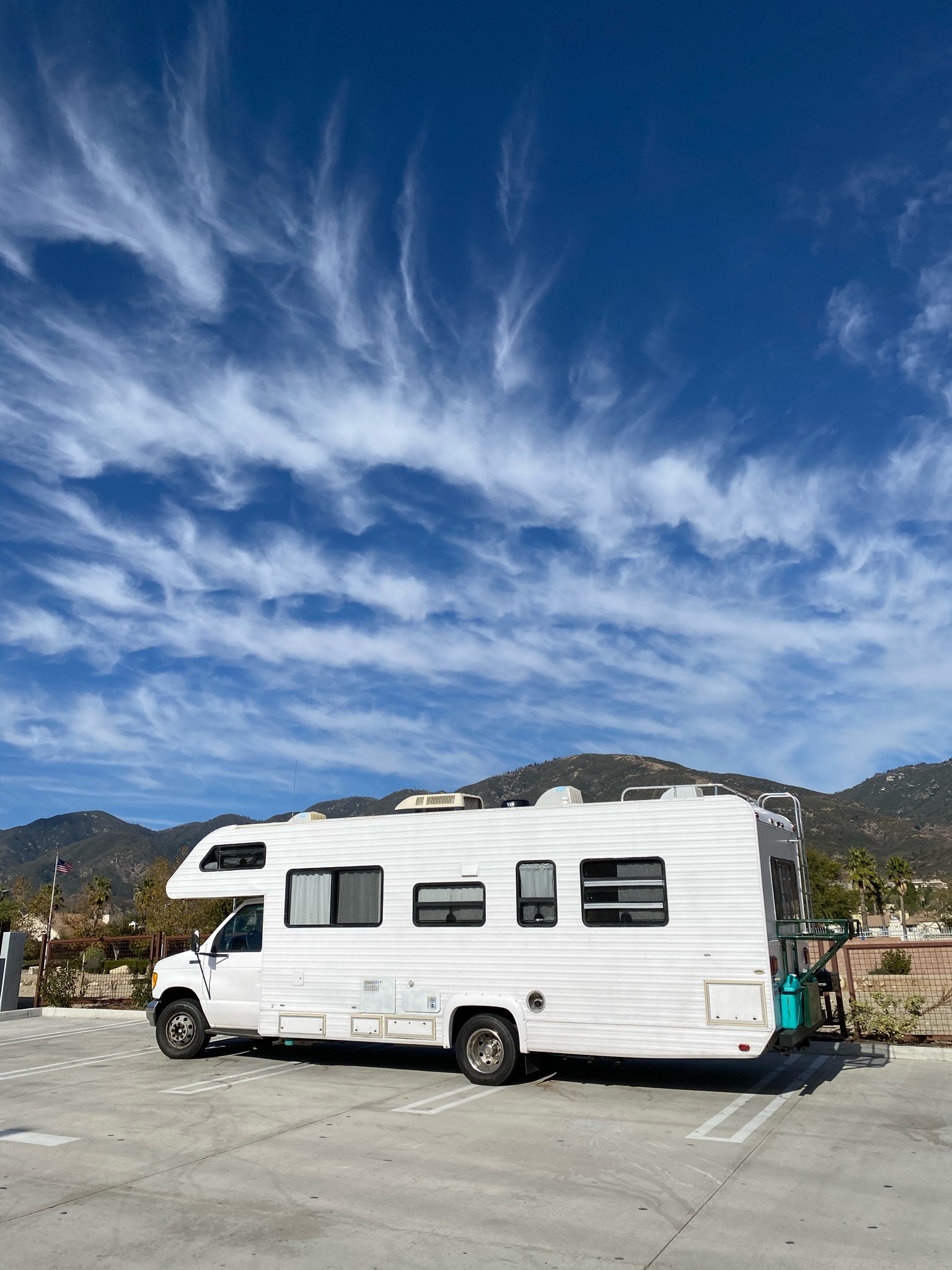 RV exterior with open door in a travel setting